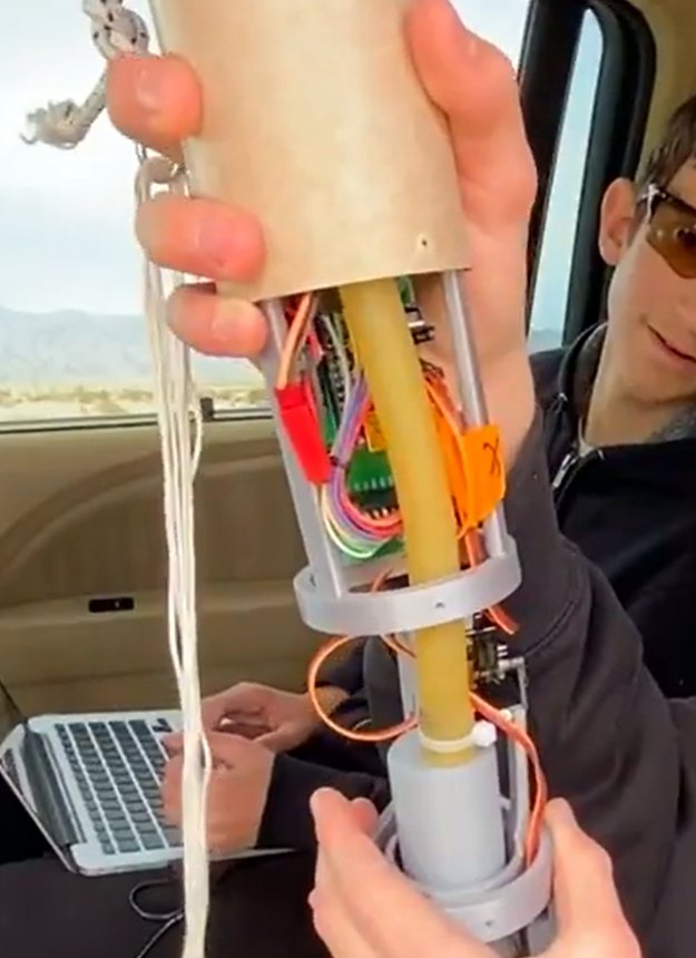 Loading the rubber pressure-transfer tube into the rocket