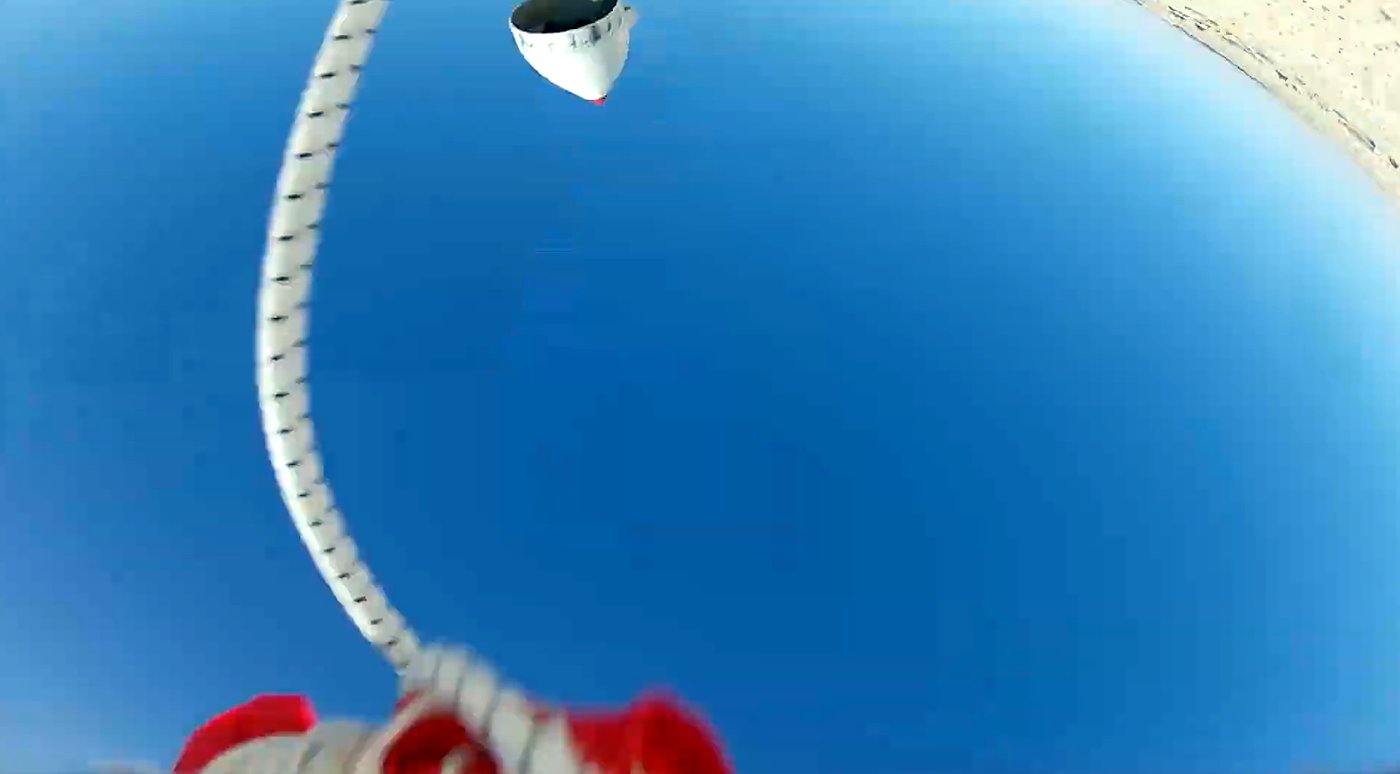 Looking up the parachute cord from the rocket during descent