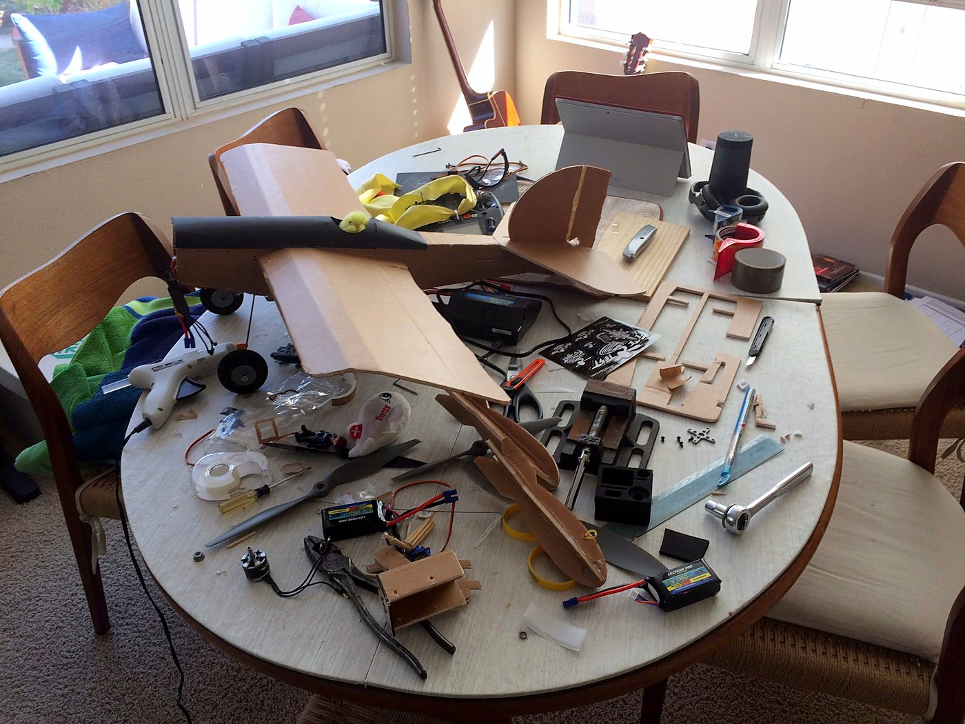 FT Simple Scout parts spread across the dinner table mid-build