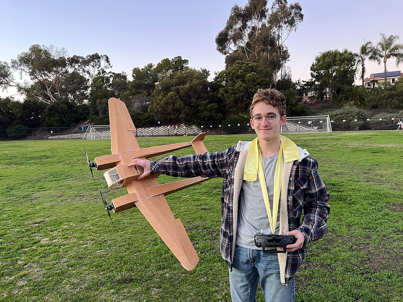 Holding the FW-189 up on a field with a transmitter in the other hand