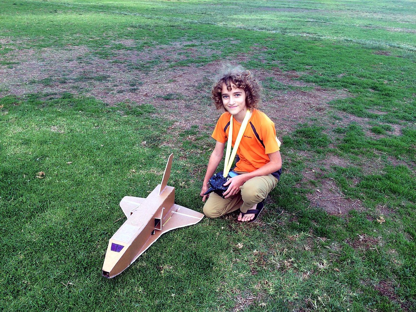 The finished space shuttle plane on a field