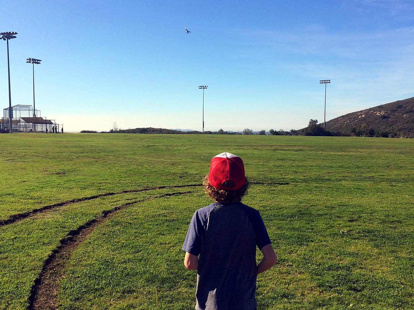 Flying the Sport Cub S at a park, the plane a speck in the sky above